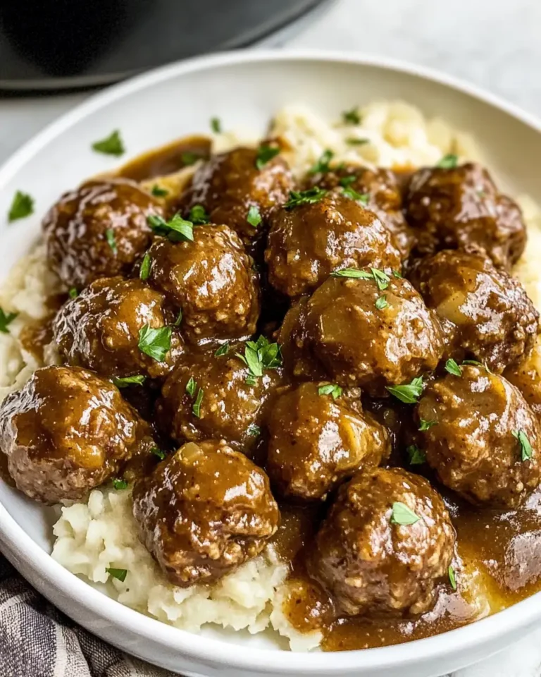 Savor the Comfort of Slowcooker Beef Meatballs with Onions & Gravy - Featured Image