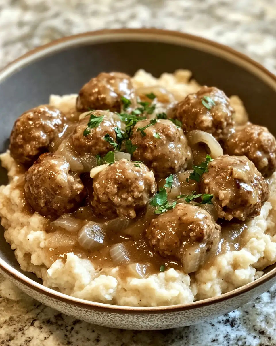 Final dish - Savor the Comfort of Slowcooker Beef Meatballs with Onions & Gravy