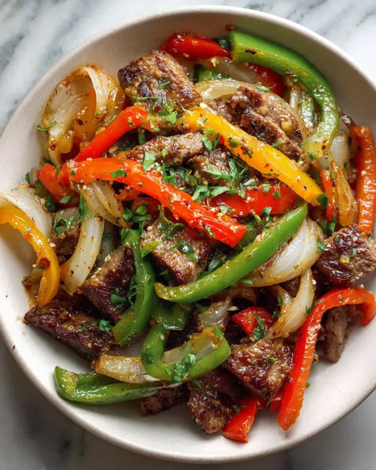 Sizzling Pepper Steak: A Flavor Fiesta with Bell Peppers and Onion - Featured Image